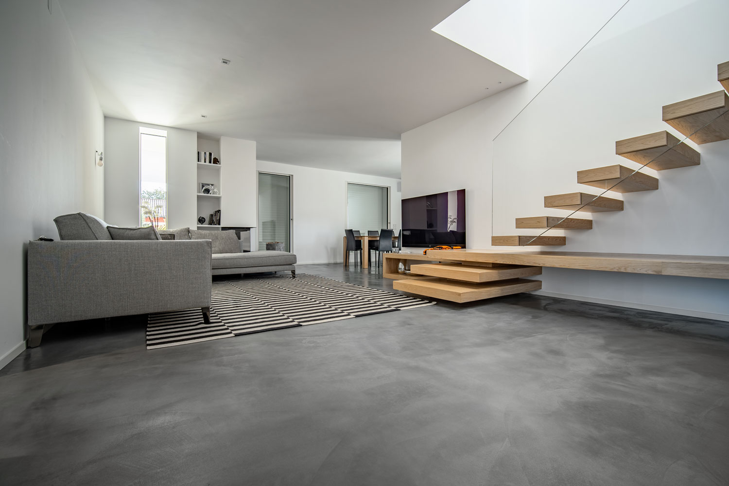 Microverlay - podea din beton rășinat cu grosime redusă - apartament privat - Studio Stocco Architetti